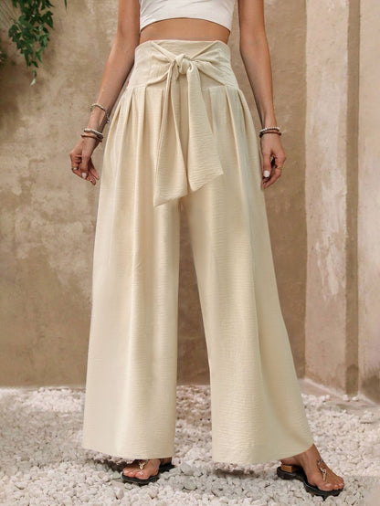 Pantaloni da donna a gamba larga, a vita alta, con laccetti sul davanti, in tinta unita, casual e drappeggiati.