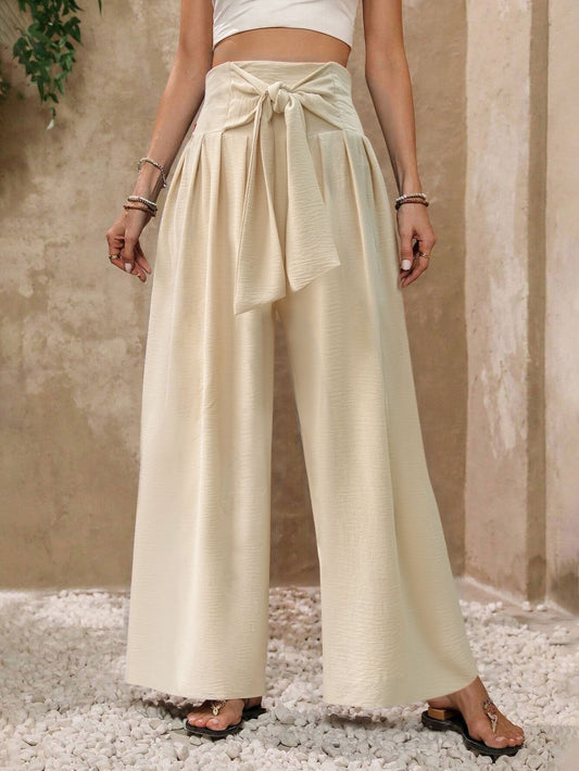 Pantaloni da donna a gamba larga, a vita alta, con laccetti sul davanti, in tinta unita, casual e drappeggiati.