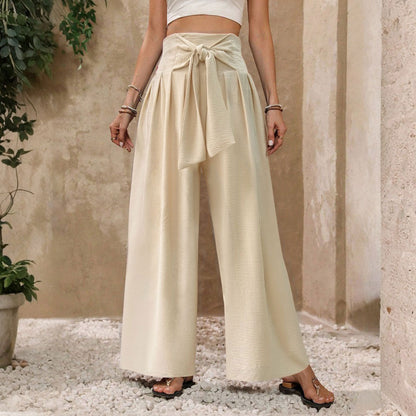 Pantaloni da donna a gamba larga, a vita alta, con laccetti sul davanti, in tinta unita, casual e drappeggiati.